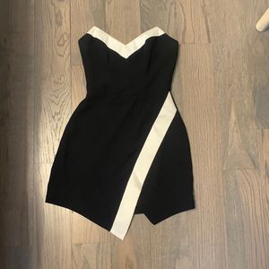Bebe dress black and white. Strapless and crossover at bottom size 2